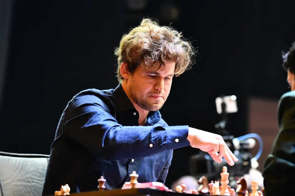 34j0hf Magnus Carlsen ChatGPT