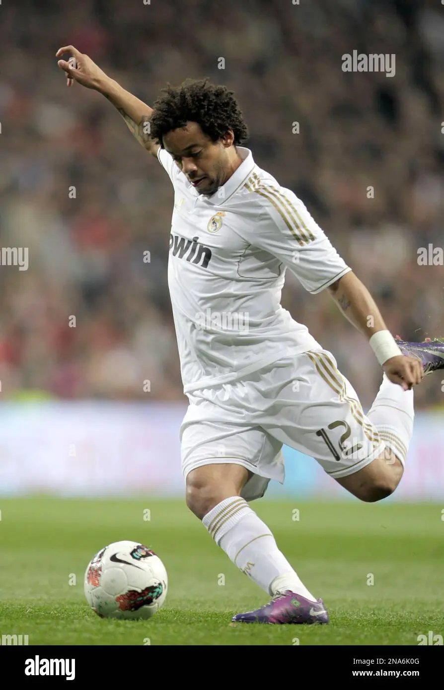 tyhi8f real madrids marcelo vieira from brazil kicks the ball during a spanish la liga soccer match at the santiago bernabeu stadium in madrid sunday march 4 2012 ap photo alberto di lolli 2NA6K0G